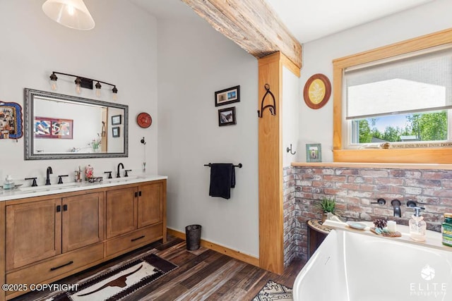 6961 S Hangar Talk Cir, Wasilla, AK 99623 - full bath featuring wood finished floors, a freestanding tub, and double vanity