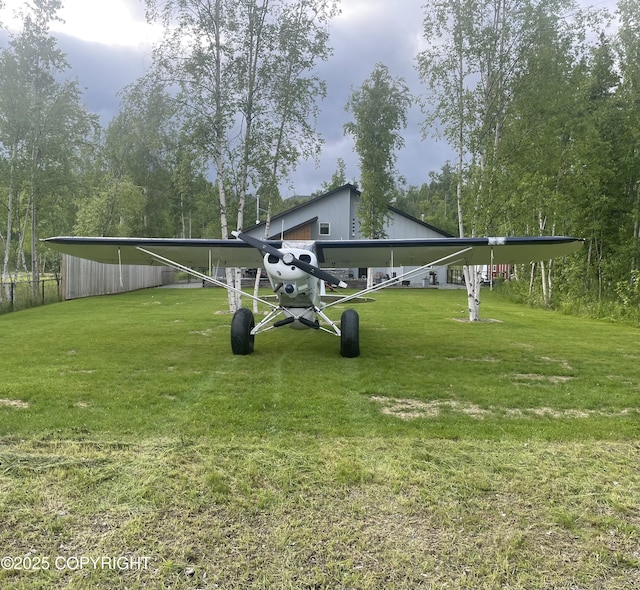 6961 S Hangar Talk Cir, Wasilla, AK 99623 - view of grassy yard with a carport