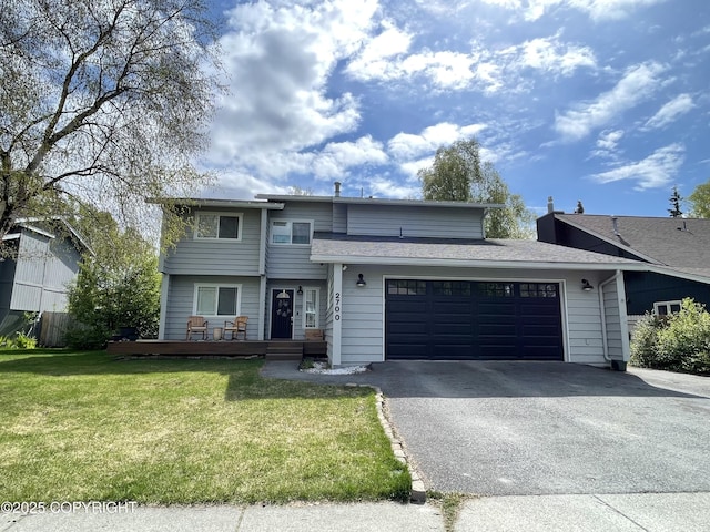 2700 Legacy Dr, Anchorage, AK 99516 - view of front of house with asphalt driveway, a garage, and a front lawn