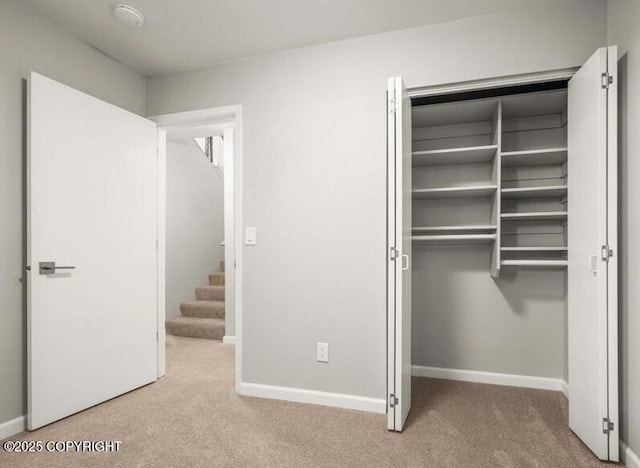 2551 Lahonda Dr, Anchorage, AK 99517 - unfurnished bedroom with carpet, baseboards, and a closet
