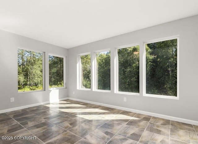 2551 Lahonda Dr, Anchorage, AK 99517 - tiled empty room with healthy amount of natural light and baseboards