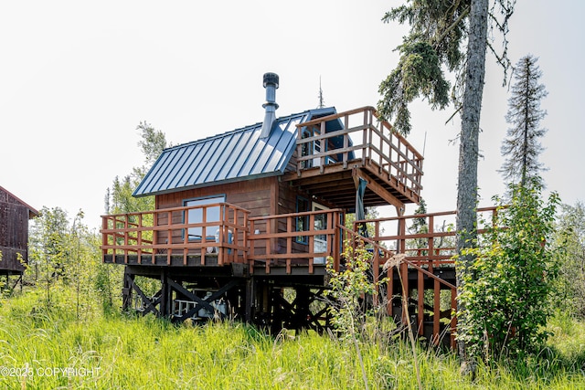 45638 Back Troll, Kenai, AK 99611 - rear view of property featuring a wooden deck, a metal roof, and a standing seam roof