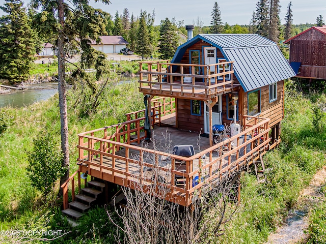 45638 Back Troll, Kenai, AK 99611 - rear view of house featuring a gambrel roof, a deck with water view, stairway, and a metal roof