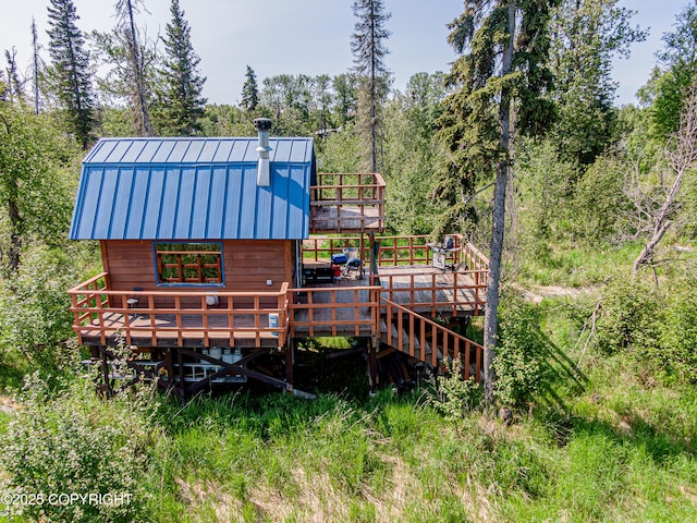 45638 Back Troll, Kenai, AK 99611 - rear view of property with a deck, a metal roof, and a standing seam roof