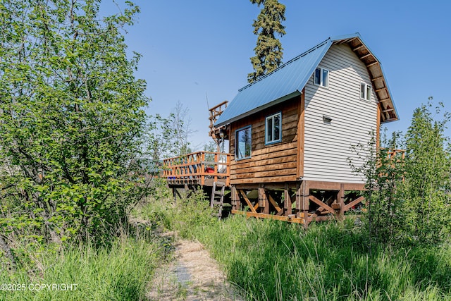 45638 Back Troll, Kenai, AK 99611 - view of home's exterior featuring a deck, a metal roof, and a gambrel roof