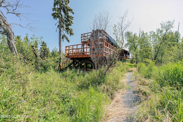 45638 Back Troll, Kenai, AK 99611 - rear view of property featuring a wooden deck and stairway