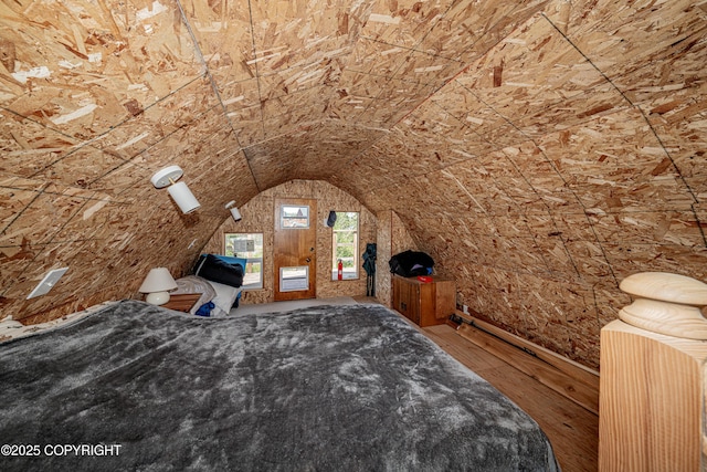 45638 Back Troll, Kenai, AK 99611 - unfurnished bedroom featuring vaulted ceiling, hardwood / wood-style flooring, and access to outside