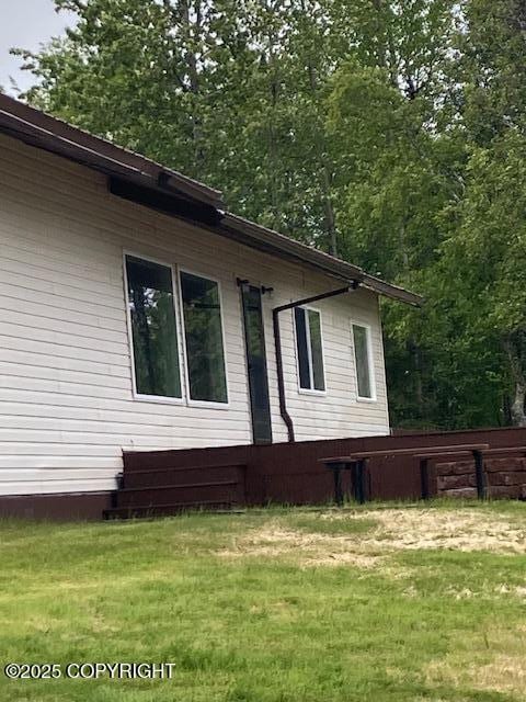 50470 Maranatha Ln, Nikiski/North Kenai, AK 99611 - view of side of home with a lawn