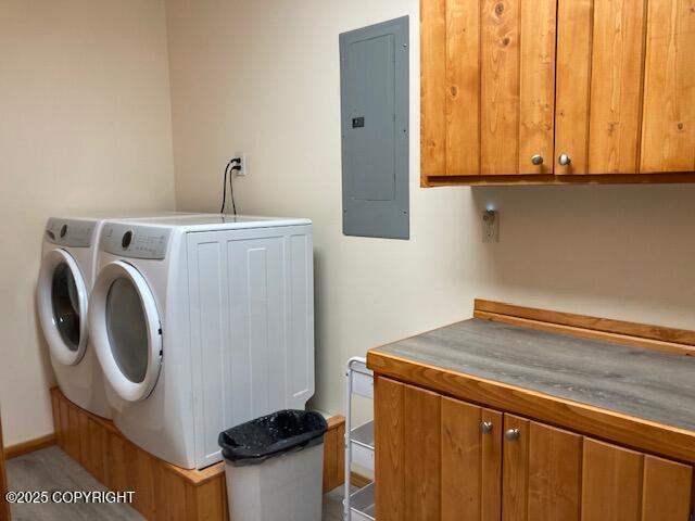 50470 Maranatha Ln, Nikiski/North Kenai, AK 99611 - laundry area with electric panel, washing machine and clothes dryer, and cabinet space