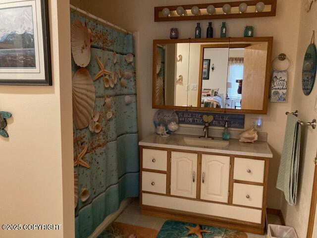 50470 Maranatha Ln, Nikiski/North Kenai, AK 99611 - full bath featuring vanity, a shower with shower curtain, and tile patterned floors