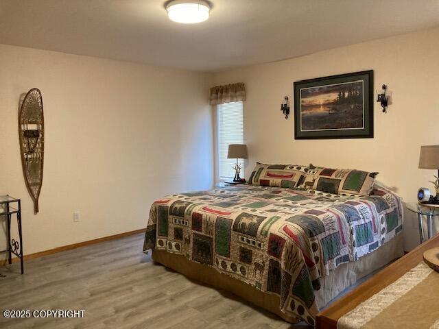 50470 Maranatha Ln, Nikiski/North Kenai, AK 99611 - bedroom with wood finished floors and baseboards