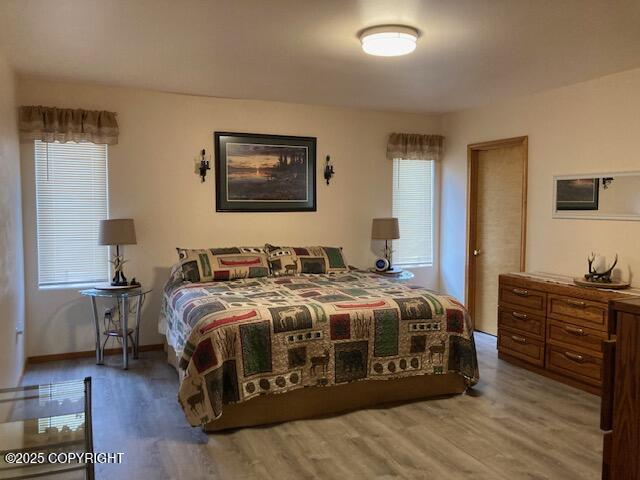 50470 Maranatha Ln, Nikiski/North Kenai, AK 99611 - bedroom with wood finished floors and baseboards