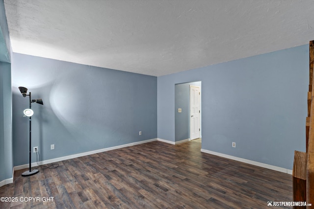 1711 Russian Jack Dr # B4, Anchorage, AK 99508 - spare room with wood finished floors, baseboards, and a textured ceiling