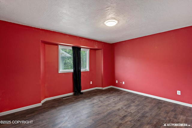 1711 Russian Jack Dr # B4, Anchorage, AK 99508 - unfurnished room with wood finished floors and a textured ceiling