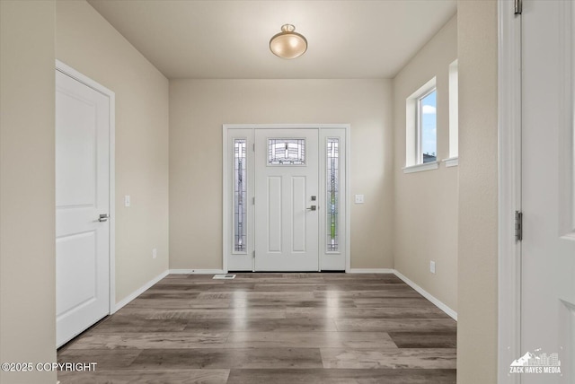 2987 Morgan Loop, Anchorage, AK 99516 - foyer entrance featuring wood finished floors and baseboards