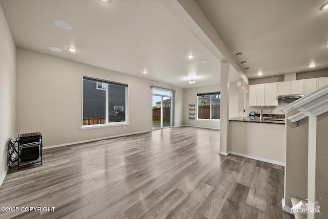 2987 Morgan Loop, Anchorage, AK 99516 - unfurnished living room with wood finished floors and recessed lighting
