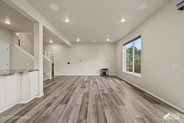 2987 Morgan Loop, Anchorage, AK 99516 - unfurnished living room with light wood finished floors, recessed lighting, and stairs