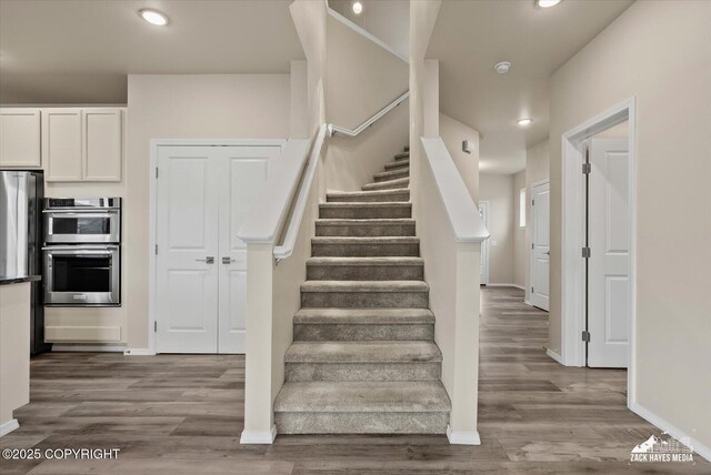 2987 Morgan Loop, Anchorage, AK 99516 - staircase featuring wood finished floors and recessed lighting