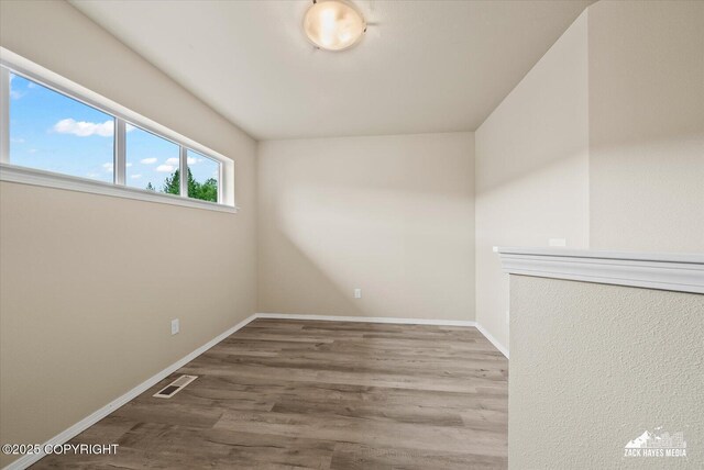 2987 Morgan Loop, Anchorage, AK 99516 - spare room with wood finished floors and baseboards