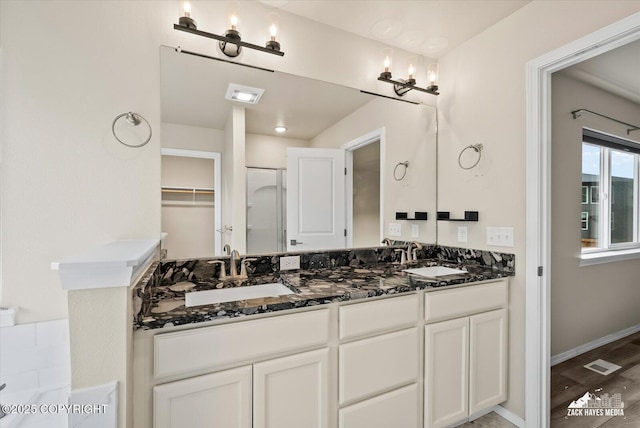 2987 Morgan Loop, Anchorage, AK 99516 - full bath featuring double vanity, a chandelier, and a shower
