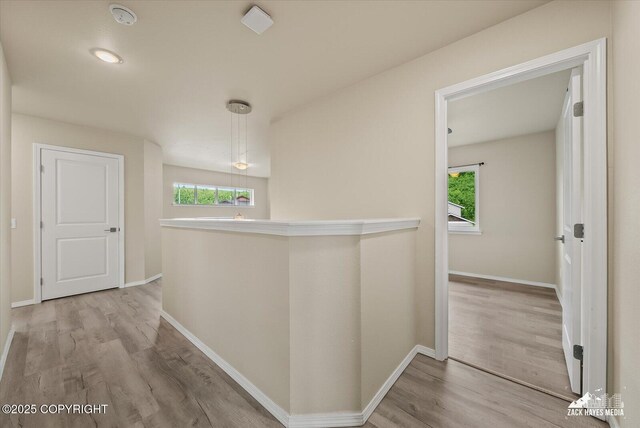 2987 Morgan Loop, Anchorage, AK 99516 - corridor featuring wood finished floors and an upstairs landing