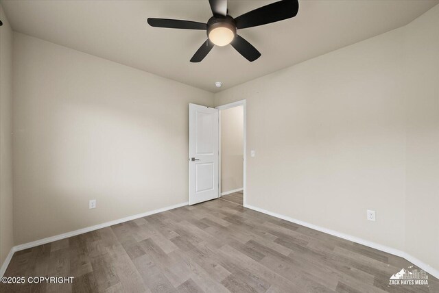 2987 Morgan Loop, Anchorage, AK 99516 - empty room with wood finished floors and a ceiling fan
