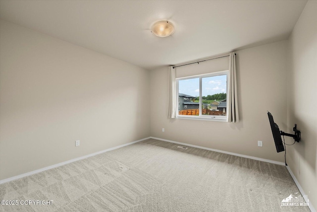 2987 Morgan Loop, Anchorage, AK 99516 - spare room featuring carpet flooring and baseboards