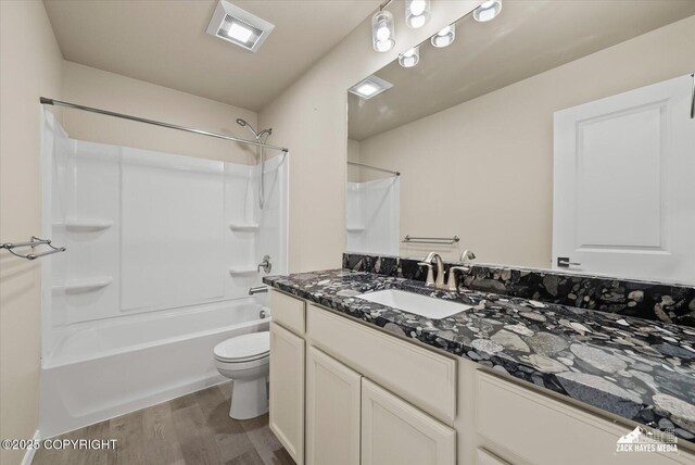 2987 Morgan Loop, Anchorage, AK 99516 - full bathroom featuring wood finished floors, vanity, and shower / washtub combination