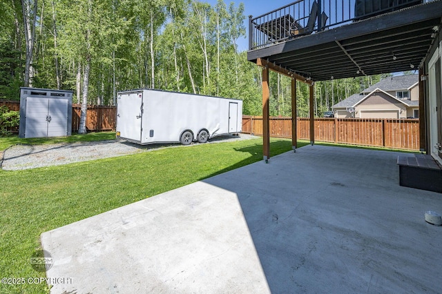 13378 Rosser Dr, Eagle River, AK 99577 - fenced backyard with a patio area and a storage shed