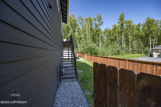 13378 Rosser Dr, Eagle River, AK 99577 - view of yard featuring stairway and a wooded view