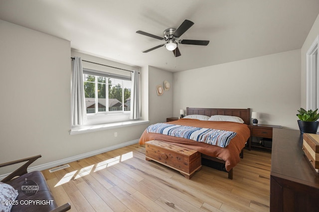 13378 Rosser Dr, Eagle River, AK 99577 - bedroom with light wood-style flooring and a ceiling fan