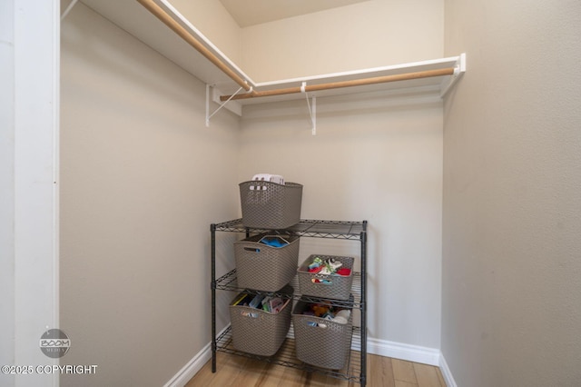 13378 Rosser Dr, Eagle River, AK 99577 - spacious closet featuring wood finished floors