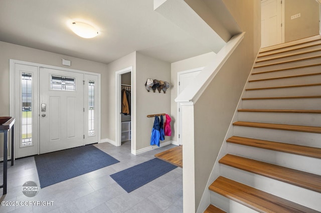 13378 Rosser Dr, Eagle River, AK 99577 - tiled foyer entrance featuring stairway and baseboards