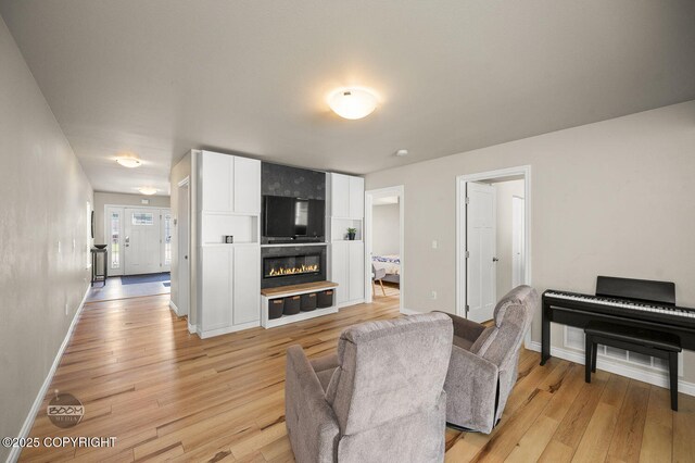 13378 Rosser Dr, Eagle River, AK 99577 - living room featuring light wood finished floors and a large fireplace