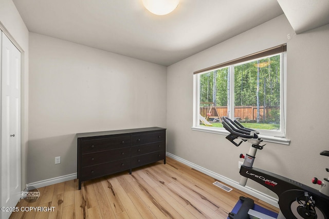 13378 Rosser Dr, Eagle River, AK 99577 - workout room with wood finished floors and baseboards
