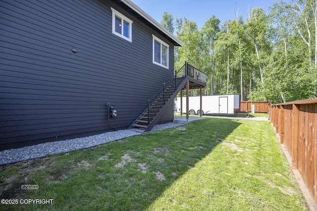 13378 Rosser Dr, Eagle River, AK 99577 - fenced backyard featuring stairs, a shed, and a deck