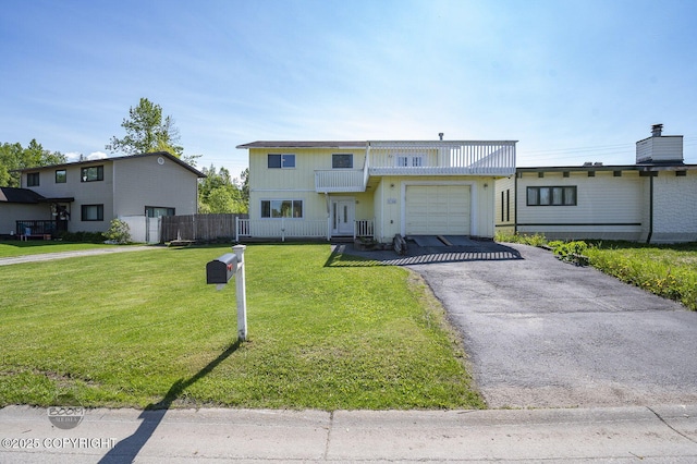 8100 E 20th Ave, Anchorage, AK 99504 - view of front of home with an attached garage and asphalt driveway