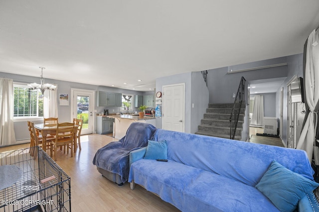 8100 E 20th Ave, Anchorage, AK 99504 - living area featuring a chandelier, stairway, light wood-style floors, and recessed lighting