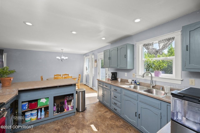 8100 E 20th Ave, Anchorage, AK 99504 - kitchen featuring light countertops, a chandelier, recessed lighting, and pendant lighting