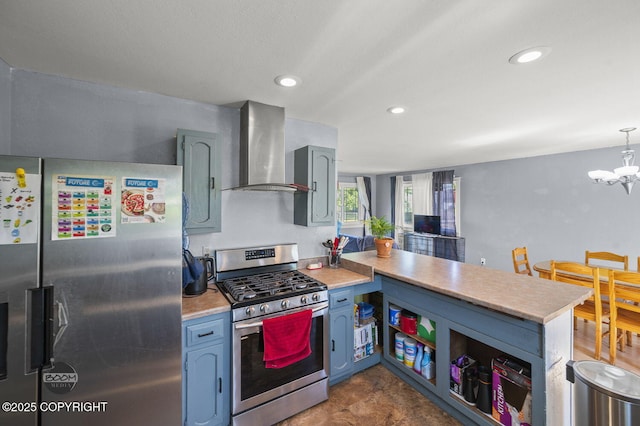 8100 E 20th Ave, Anchorage, AK 99504 - kitchen with appliances with stainless steel finishes, wall chimney exhaust hood, a peninsula, light countertops, and a chandelier