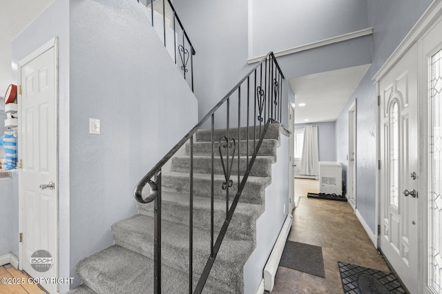 8100 E 20th Ave, Anchorage, AK 99504 - stairs featuring a baseboard heating unit and recessed lighting