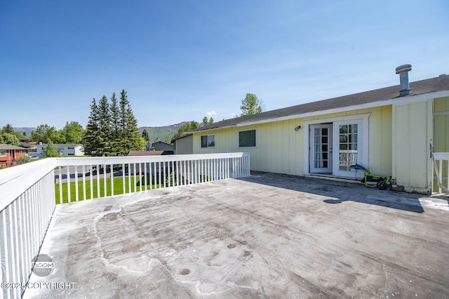 8100 E 20th Ave, Anchorage, AK 99504 - view of patio / terrace featuring french doors