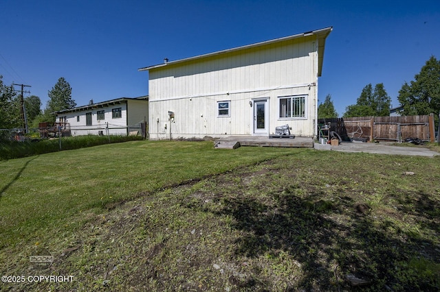 8100 E 20th Ave, Anchorage, AK 99504 - rear view of property featuring a fenced backyard and a wooden deck