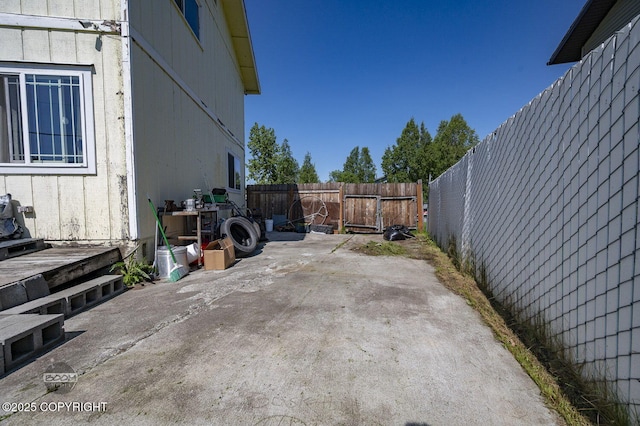 8100 E 20th Ave, Anchorage, AK 99504 - fenced backyard with a patio