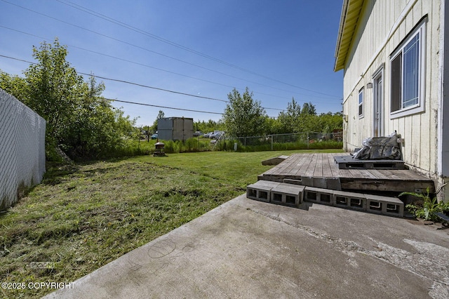 8100 E 20th Ave, Anchorage, AK 99504 - view of yard featuring a wooden deck and a patio area