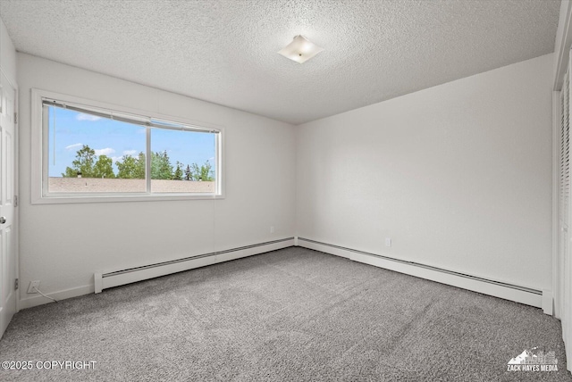 943 E 12th Ave # 6, Anchorage, AK 99501 - carpeted spare room with a textured ceiling and a baseboard radiator