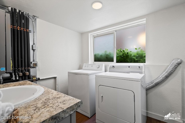 943 E 12th Ave # 6, Anchorage, AK 99501 - laundry area with washer and clothes dryer and dark wood-style flooring