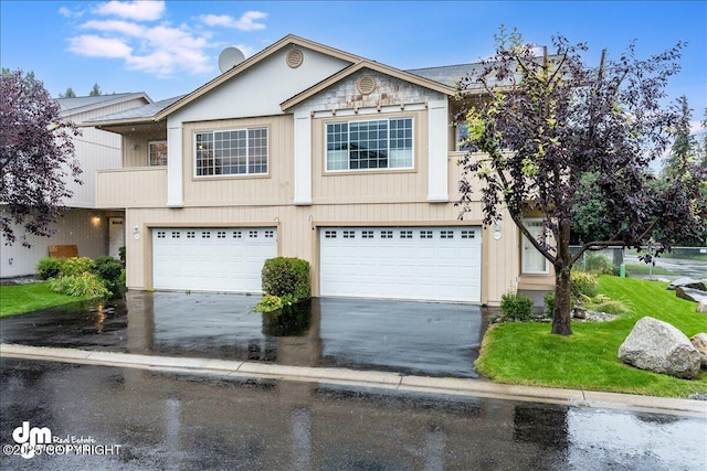 5621 Sapphire Loop # 18A, Anchorage, AK 99504 - view of front facade with driveway and a garage