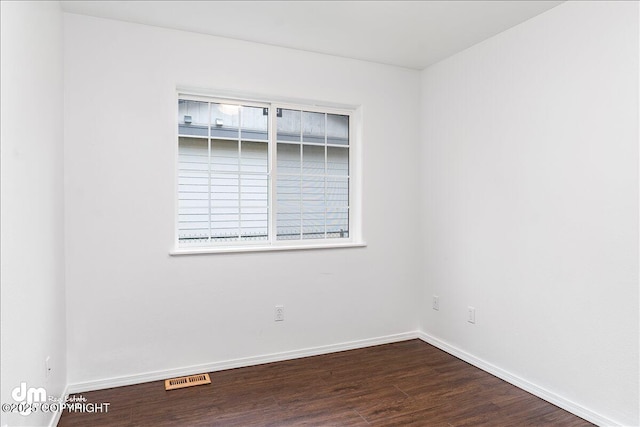 5621 Sapphire Loop Unit 18A, Anchorage, AK 99504 - spare room featuring wood finished floors and baseboards