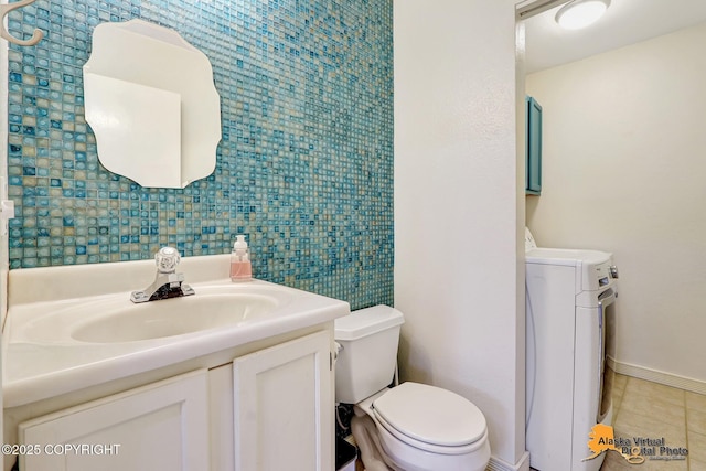 2003 Jamestown Cir, Anchorage, AK 99507 - half bathroom featuring washer / clothes dryer, vanity, and tile patterned floors